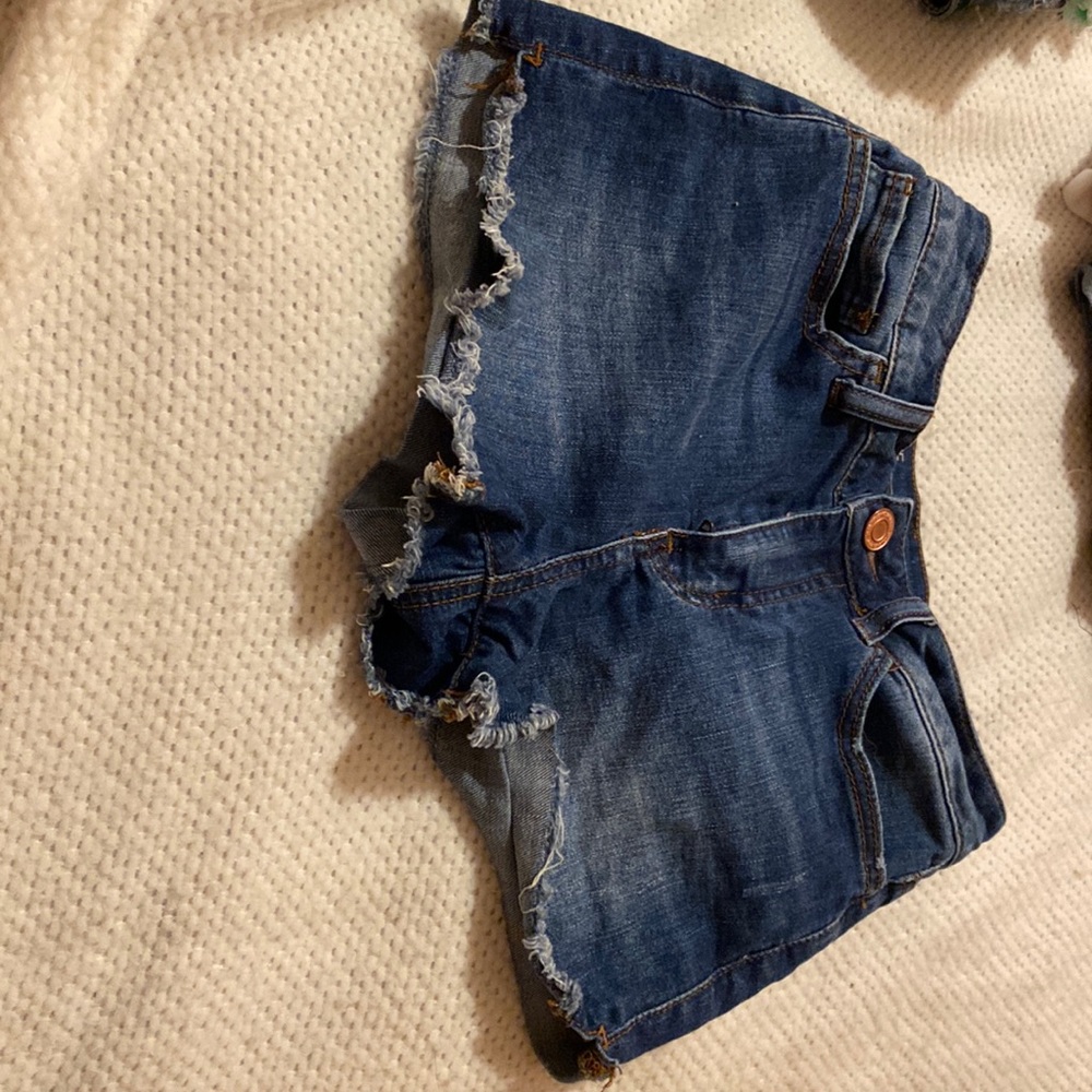 So brand medium blue denim. Sized 1. Frayed bottom.